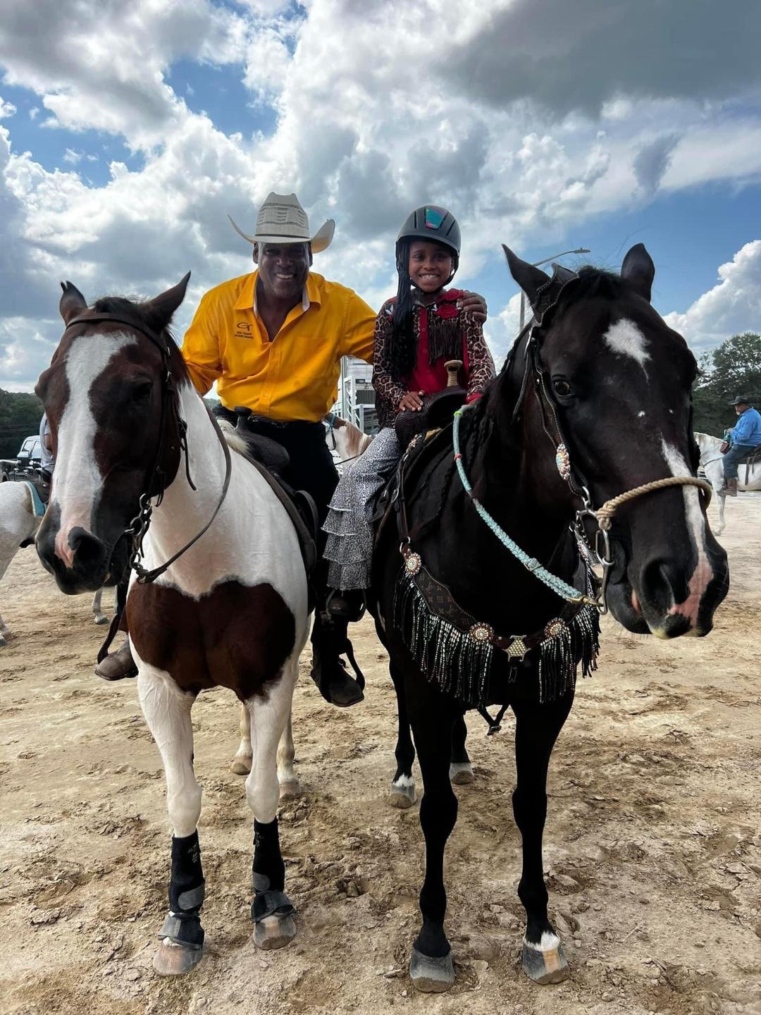 Riders on horseback at Gus Trent Rodeo Association